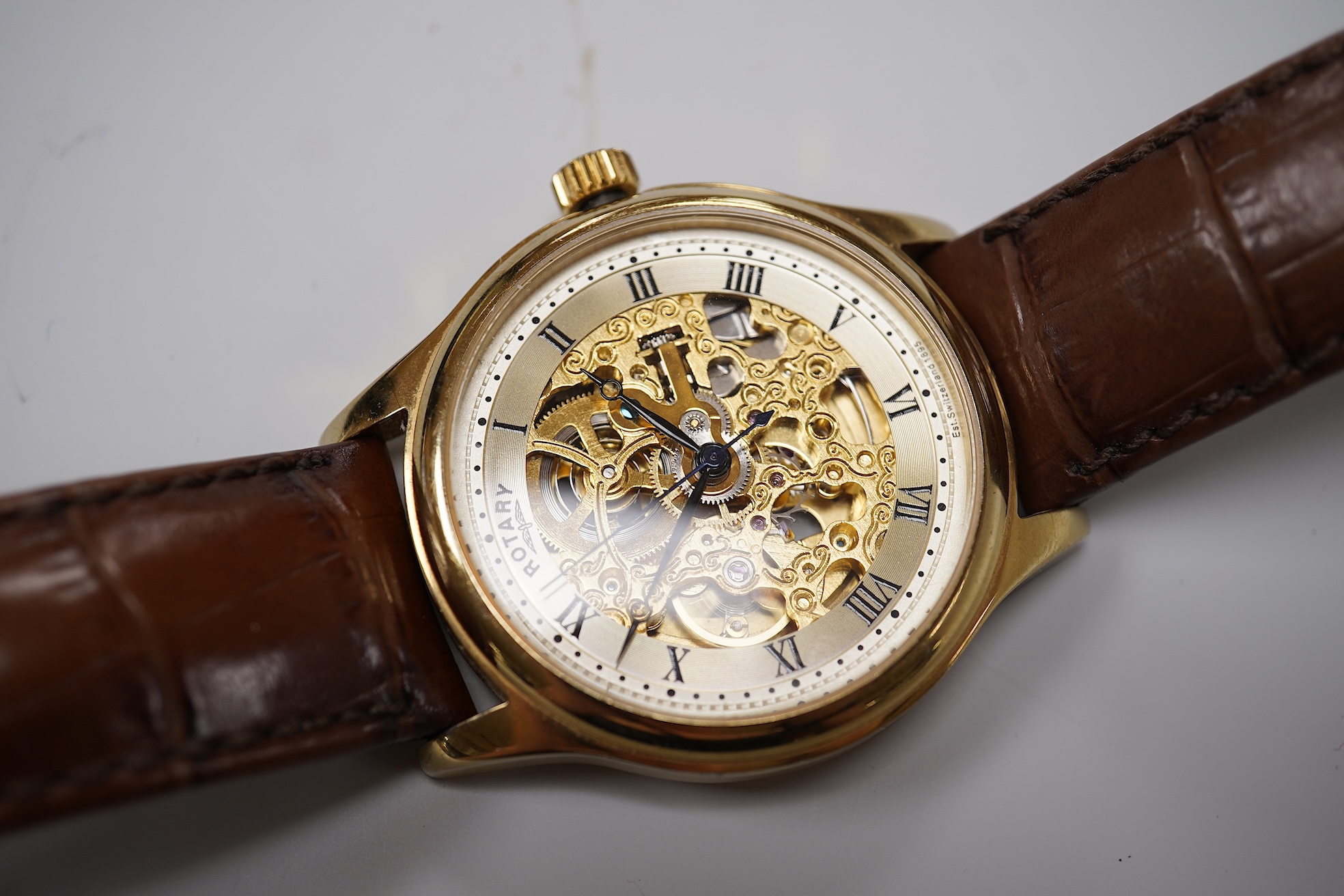 Four assorted gentleman's recent wrist watches including gilt stainless steel Rotary with visible escapement, Sekonda and Seiko.